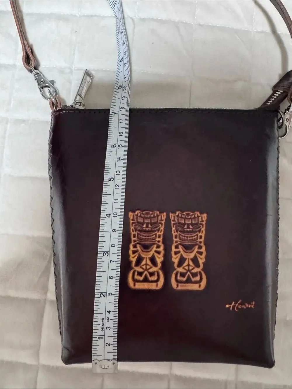 Dark Brown Leather Crossbody Bag with Embossed Tiki Design from Hawaii